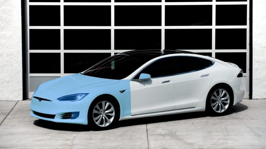 Full front paint protection film coverage example on a white sedan