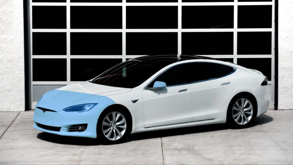 Partial front paint protection film coverage example on a white sedan